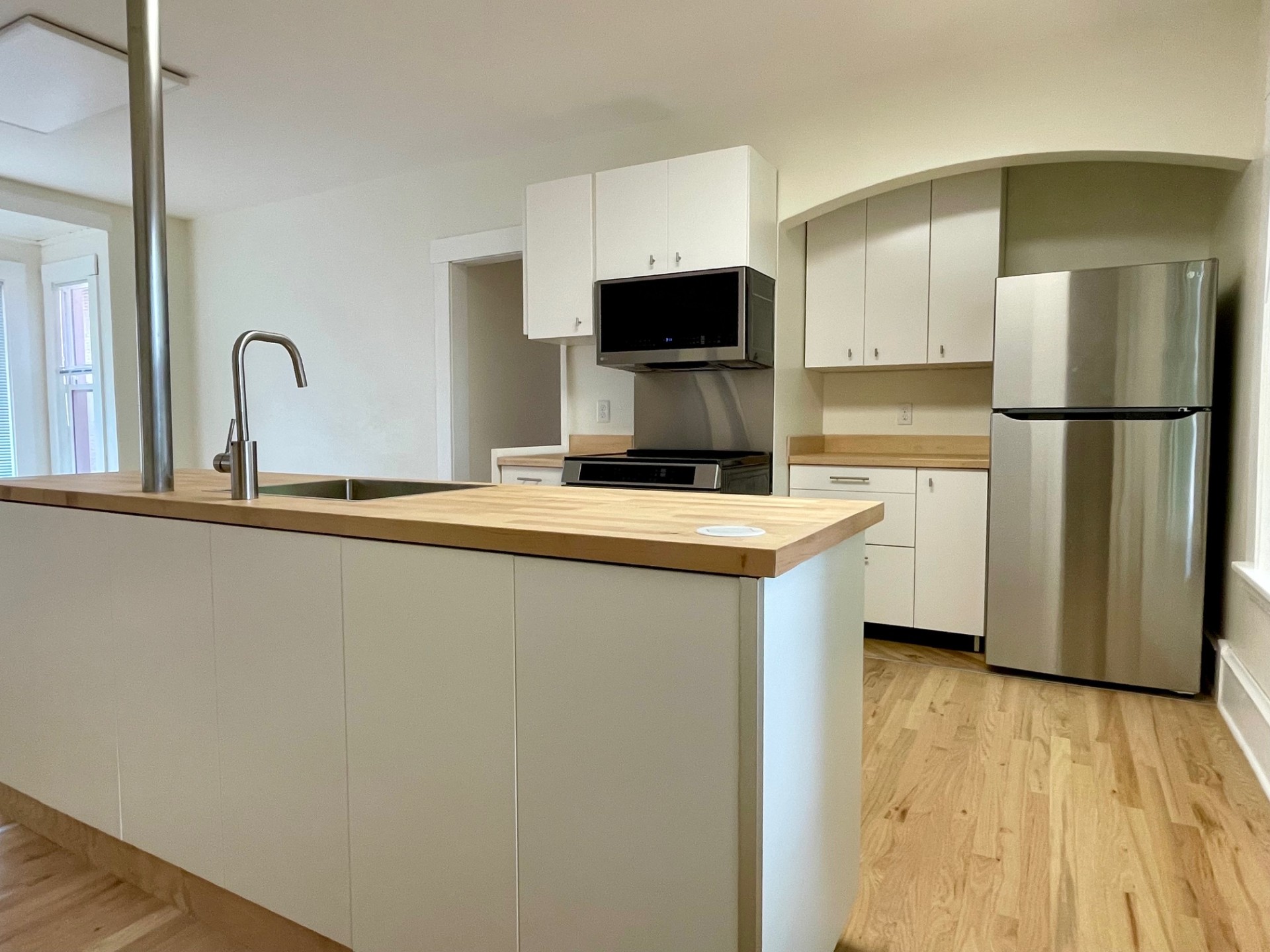 Kitchen with island in the foreground